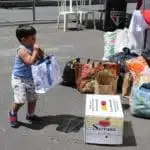 Crianca com donativo | Arquibancada Tricolor